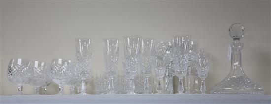 A Waterford cut crystal twenty six piece suite of drinking glasses and a ships decanter with stopper